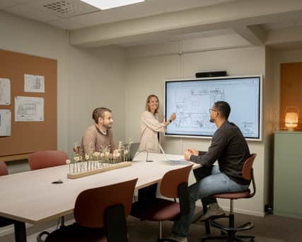 Three people in an office.